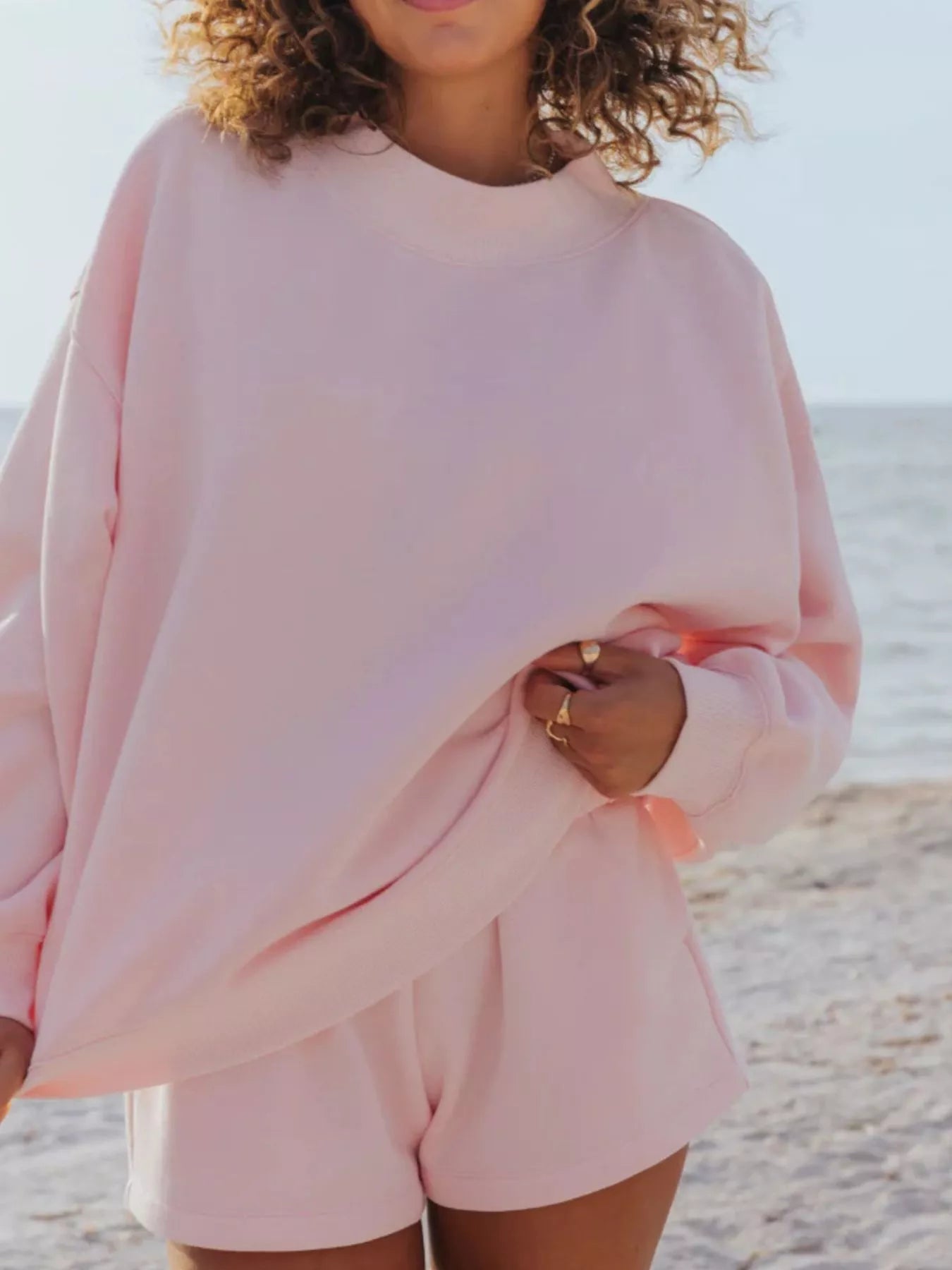 Relaxed Fit Round Neck Sweatshirt and Shorts Set in light pink, casual beach wear for a stylish summer look.