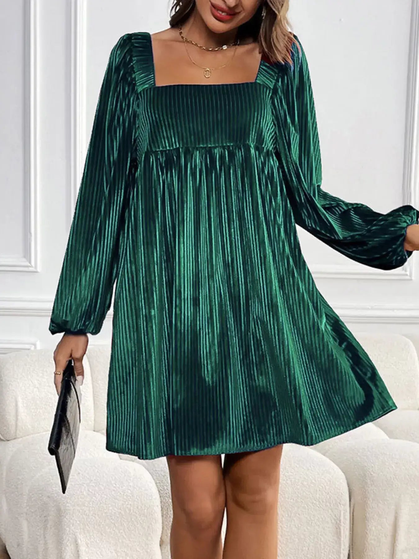 Stylish woman wearing a Velvet Square Neck Long Sleeve Dress in green, ideal for elegant evening style.