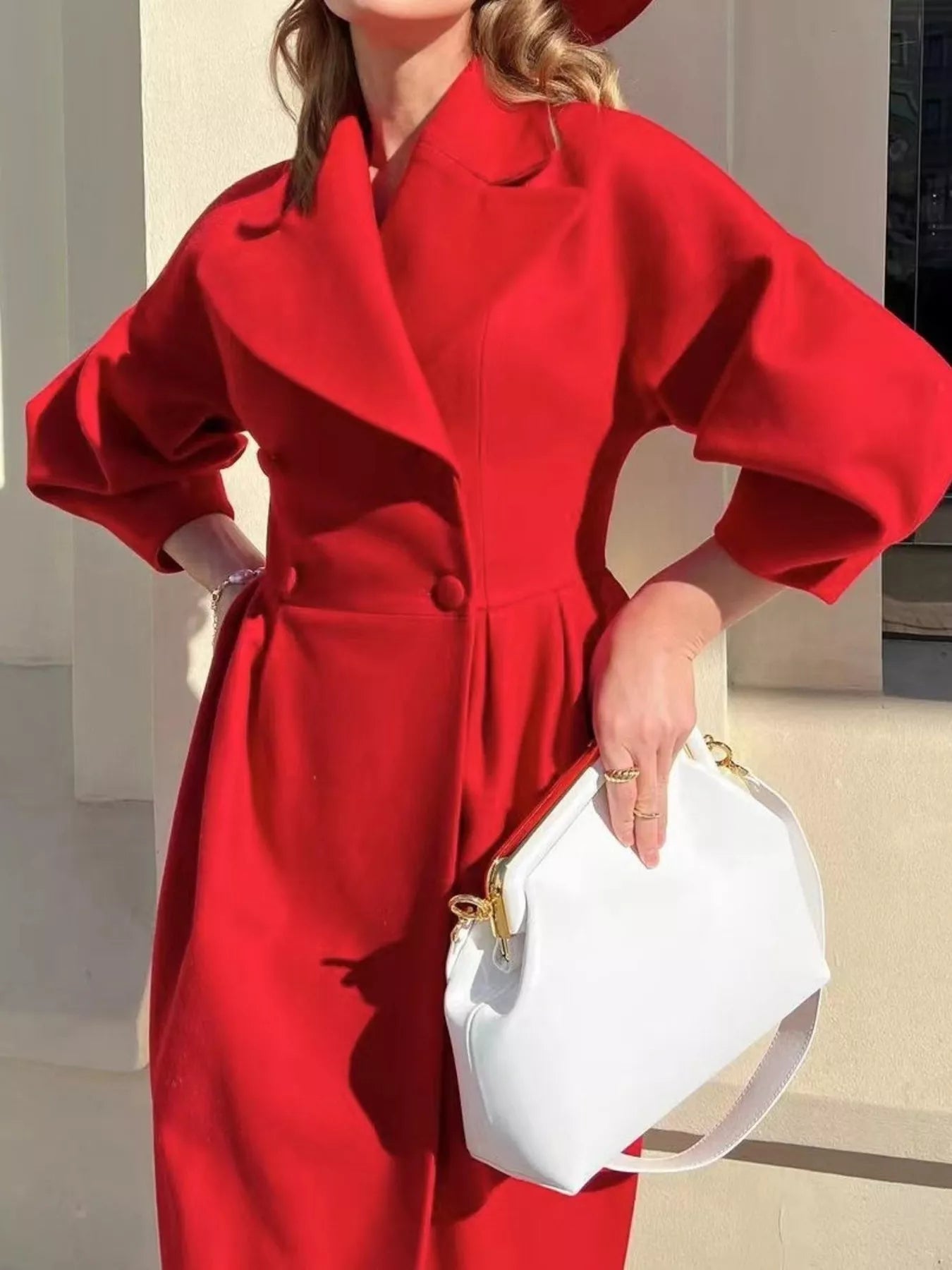 Double-Breasted Longline Coat in vibrant red with elegant tailored silhouette, featuring buttoned front and ruched sleeves.
