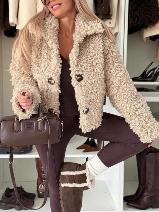 Model wearing Sherpa Button-Down Outerwear in beige, made of 100% polyester, featuring button details and a cozy fit.