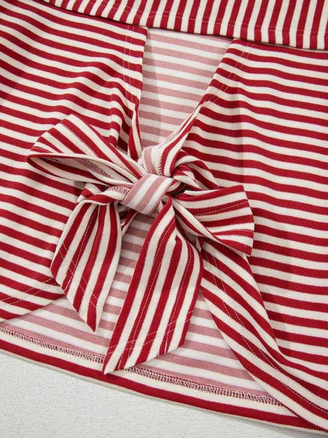 Striped Back Bow Tie T-Shirt featuring a tied bow detail with red and pink stripes.