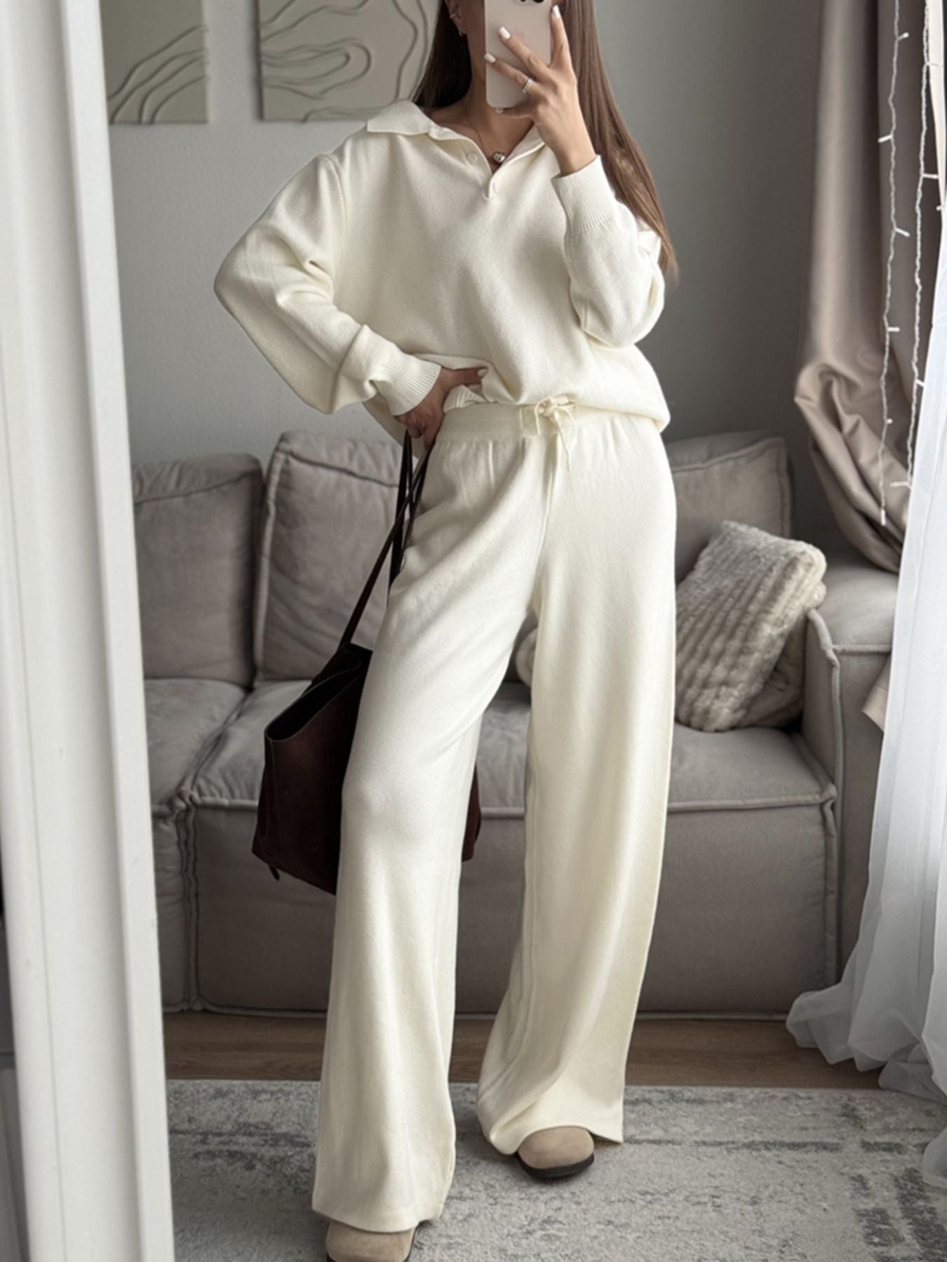Woman wearing Polo Collar Knit Two Piece Set in cream color, featuring a relaxed top and wide-leg pants.