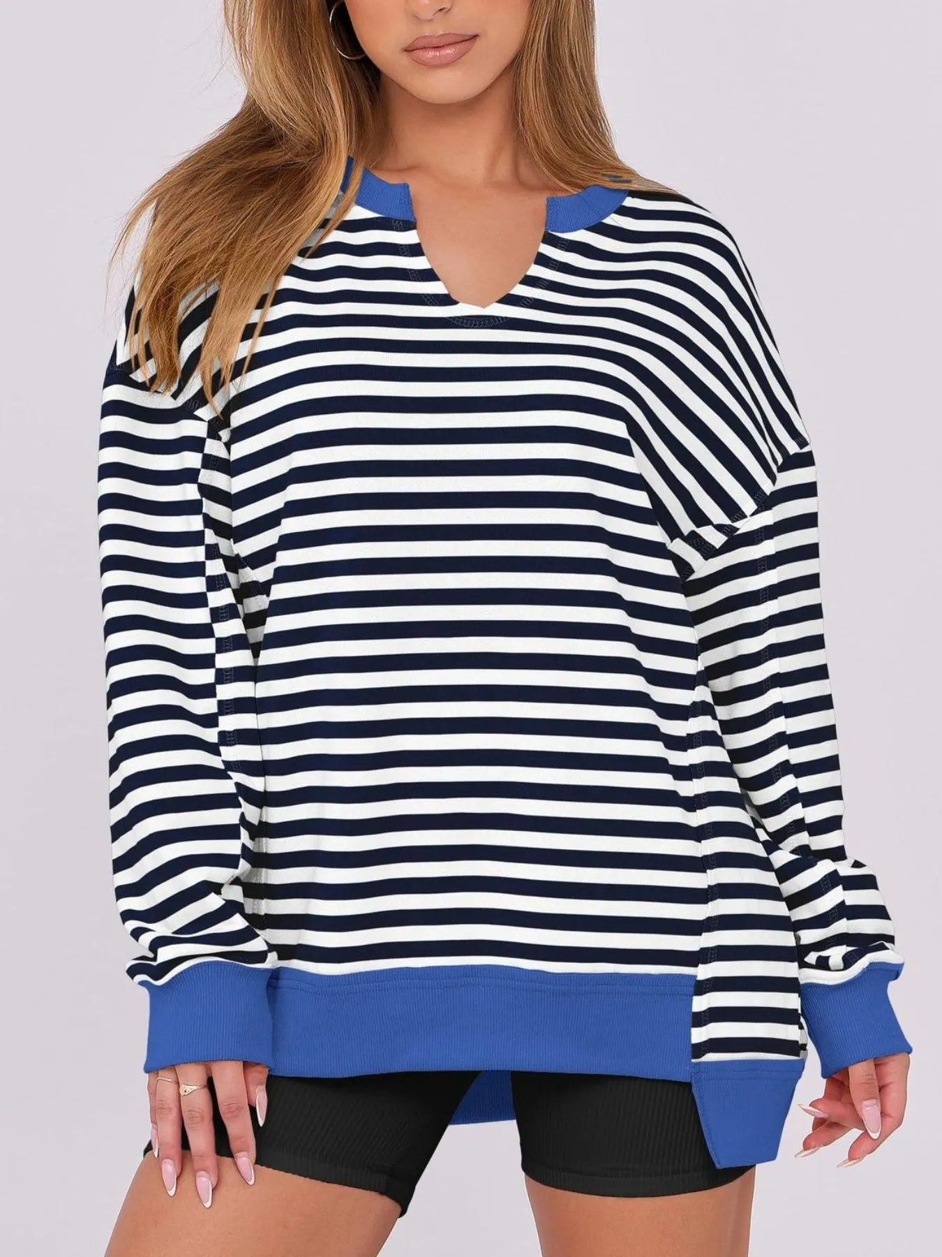 Notched Long Sleeve Oversized Sweatshirt with striped design for casual wear, featuring contrast stitching and a relaxed fit.