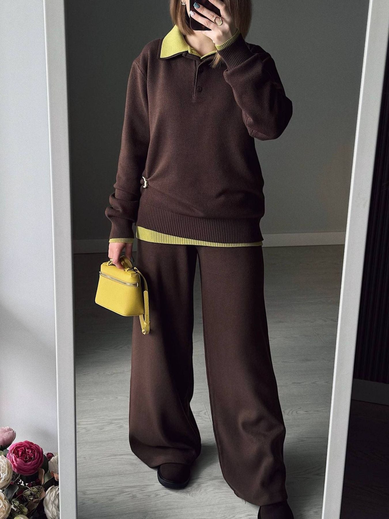 Model wearing Polo Collar Knit Two Piece Set featuring a brown top and pants outfit with a yellow handbag.