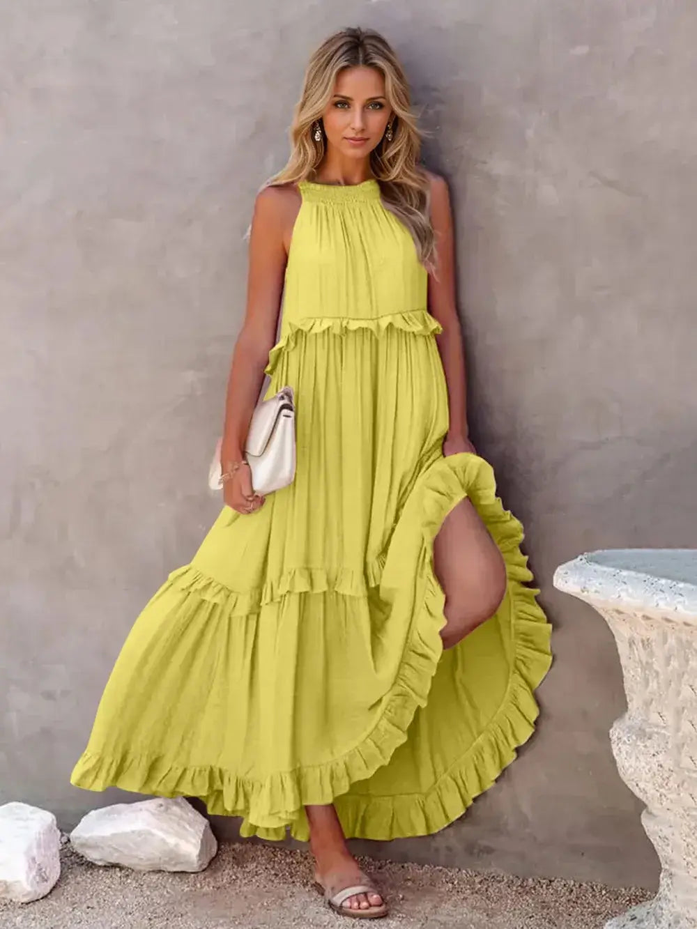 Ruffled Sleeveless Tiered Maxi Dress with Pockets in bright yellow, featuring soft ruffles and a flowing silhouette.