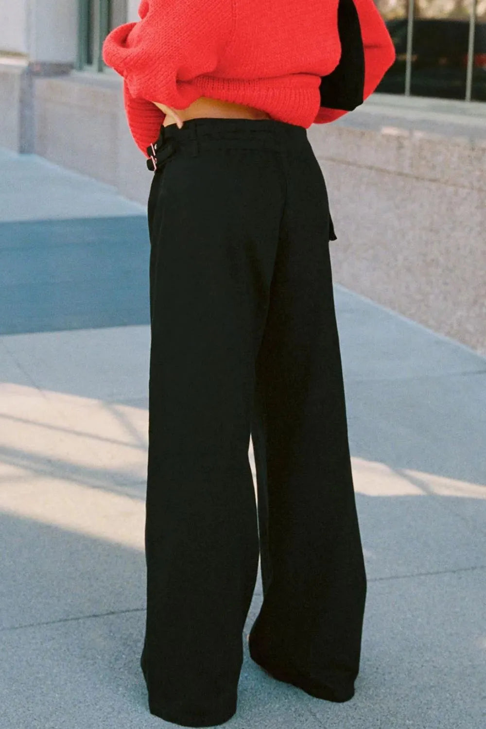 Wide Leg Jeans with Pockets worn with a stylish sweater, showcasing the pocketed design and comfortable fit.