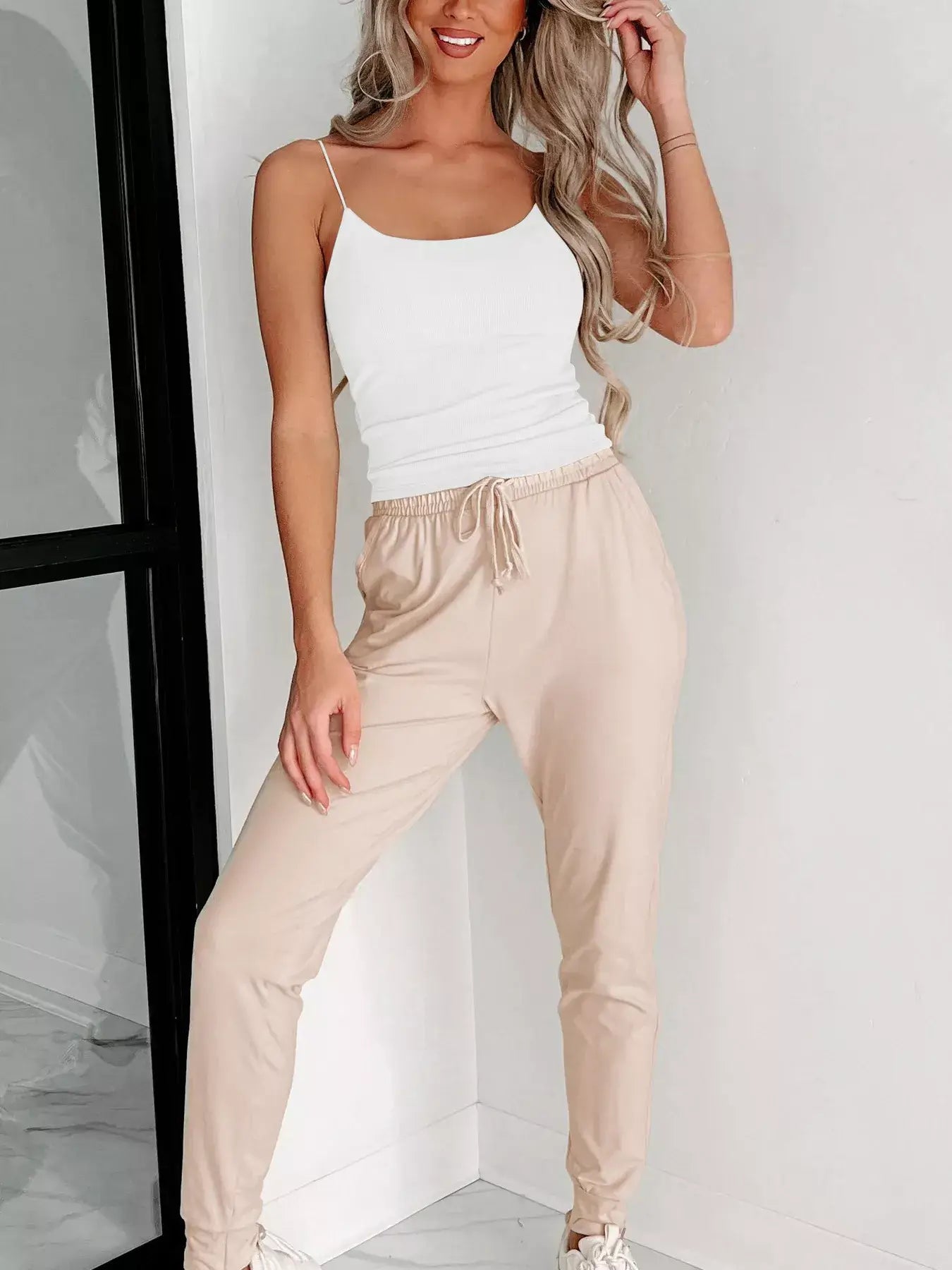Scoop Neck Cami worn with beige joggers, showcasing a stylish and casual outfit perfect for any occasion.