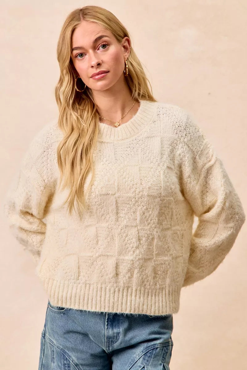 BiBi Checker Board Drop Shoulder Sweater in cream with relaxed fit and comfy design for trendy casual looks.