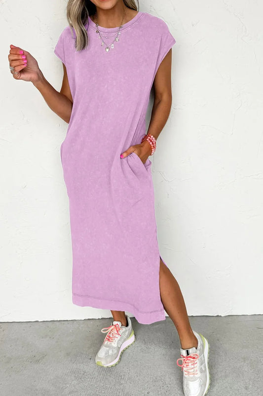 Woman wearing a Side Split Round Neck Cap Sleeve T-Shirt Dress in lavender, showcasing pockets and a stylish slit.