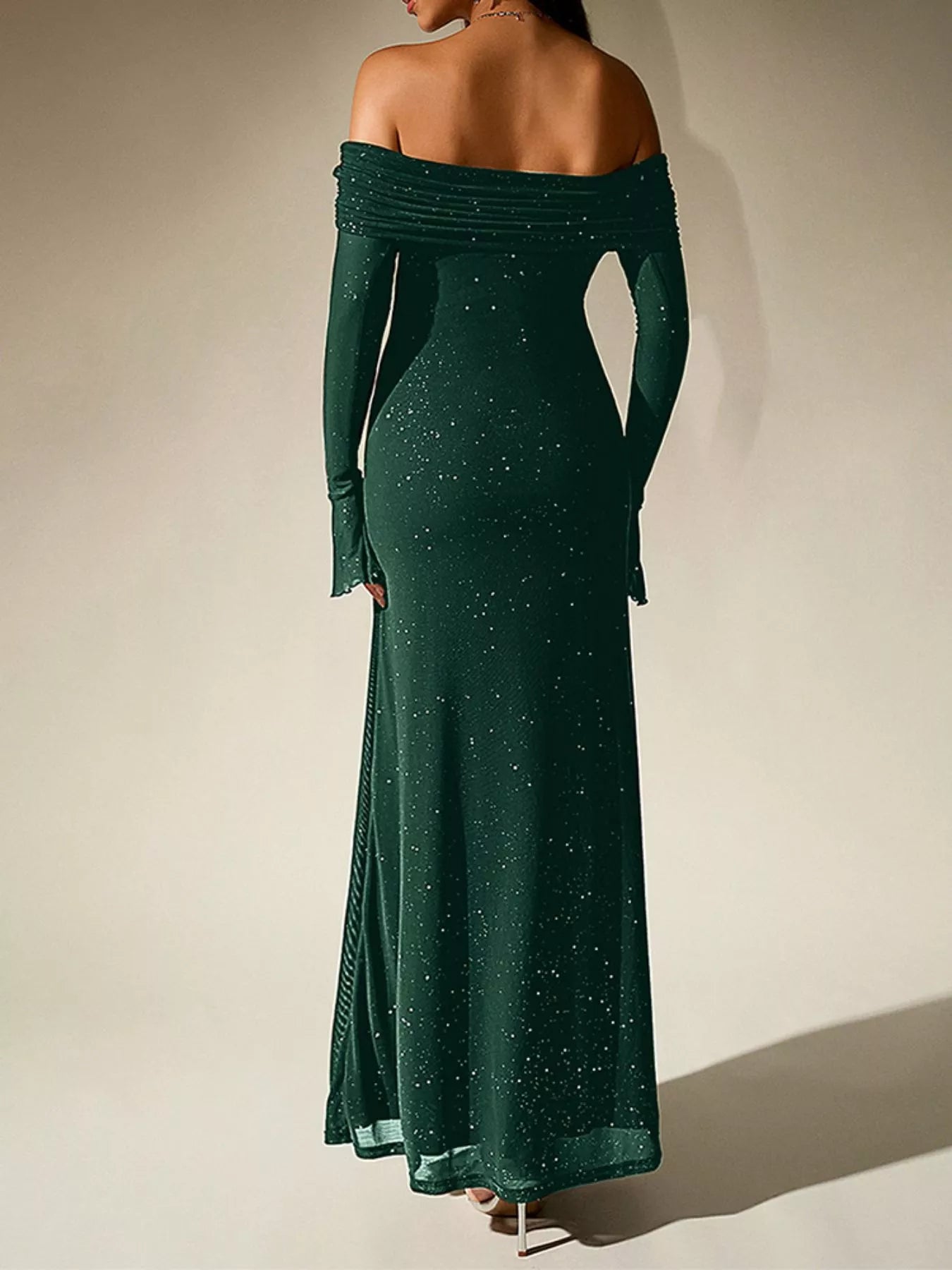 Back view of Glitter Off-Shoulder Maxi Dress, showcasing its sparkling design and elegant silhouette.