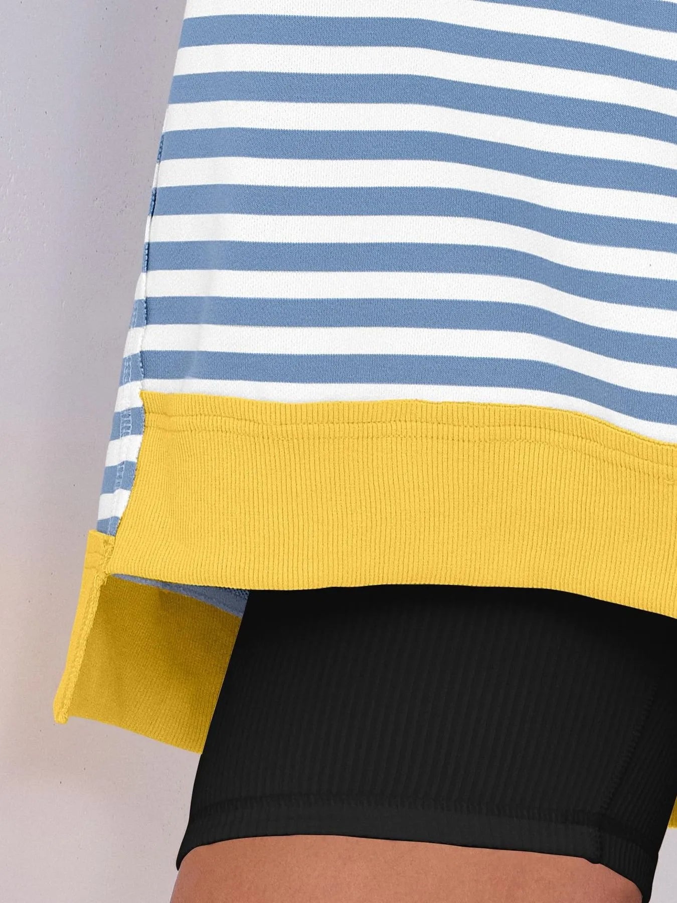 Notched Long Sleeve Oversized Sweatshirt showing striped design and yellow hem detail.