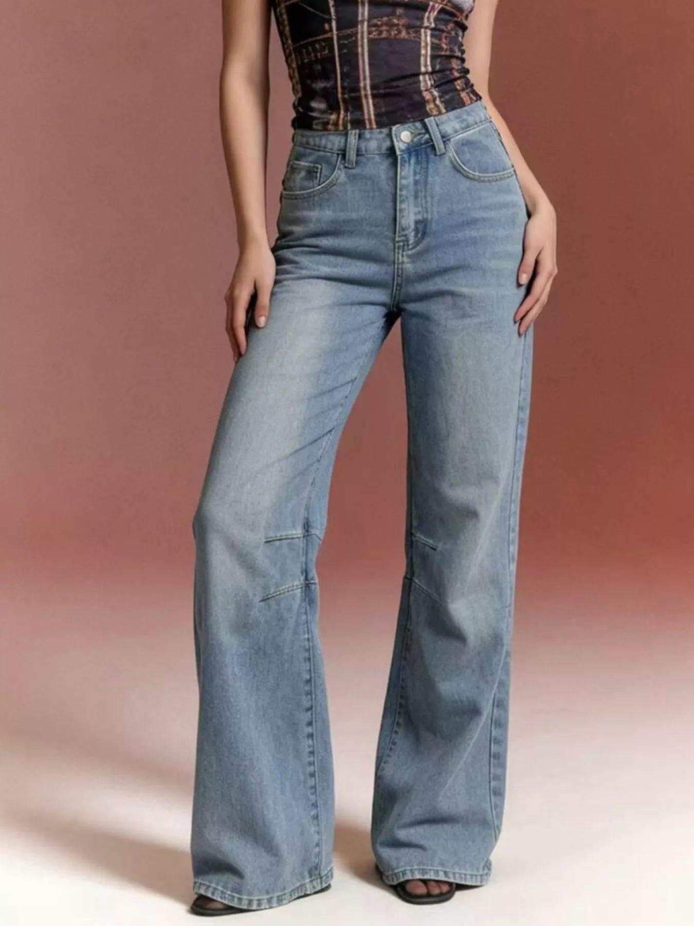 Wide Leg Wash Jeans with Buttoned Pocketed Design in light blue, featuring a trendy and stylish fit.