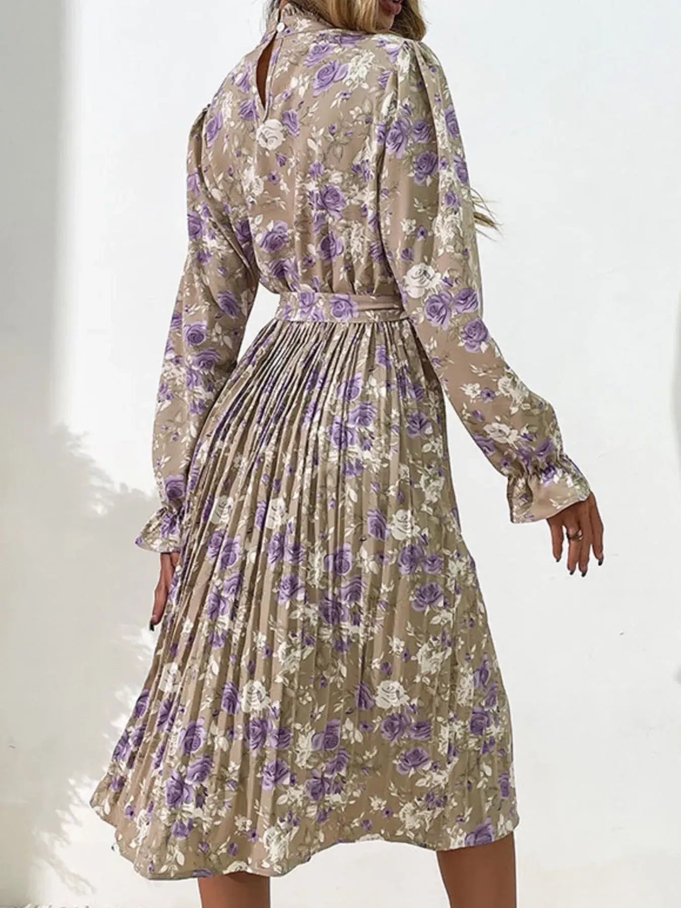 Floral Print Long Sleeve Pleated Midi Dress showcasing elegant pleated skirt and floral design on a model.