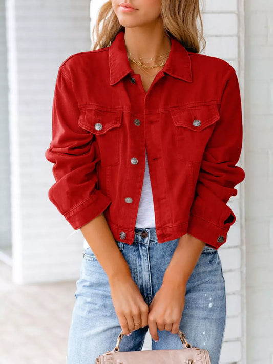 Red button-up long sleeve denim jacket for women styled with jeans and a casual top.