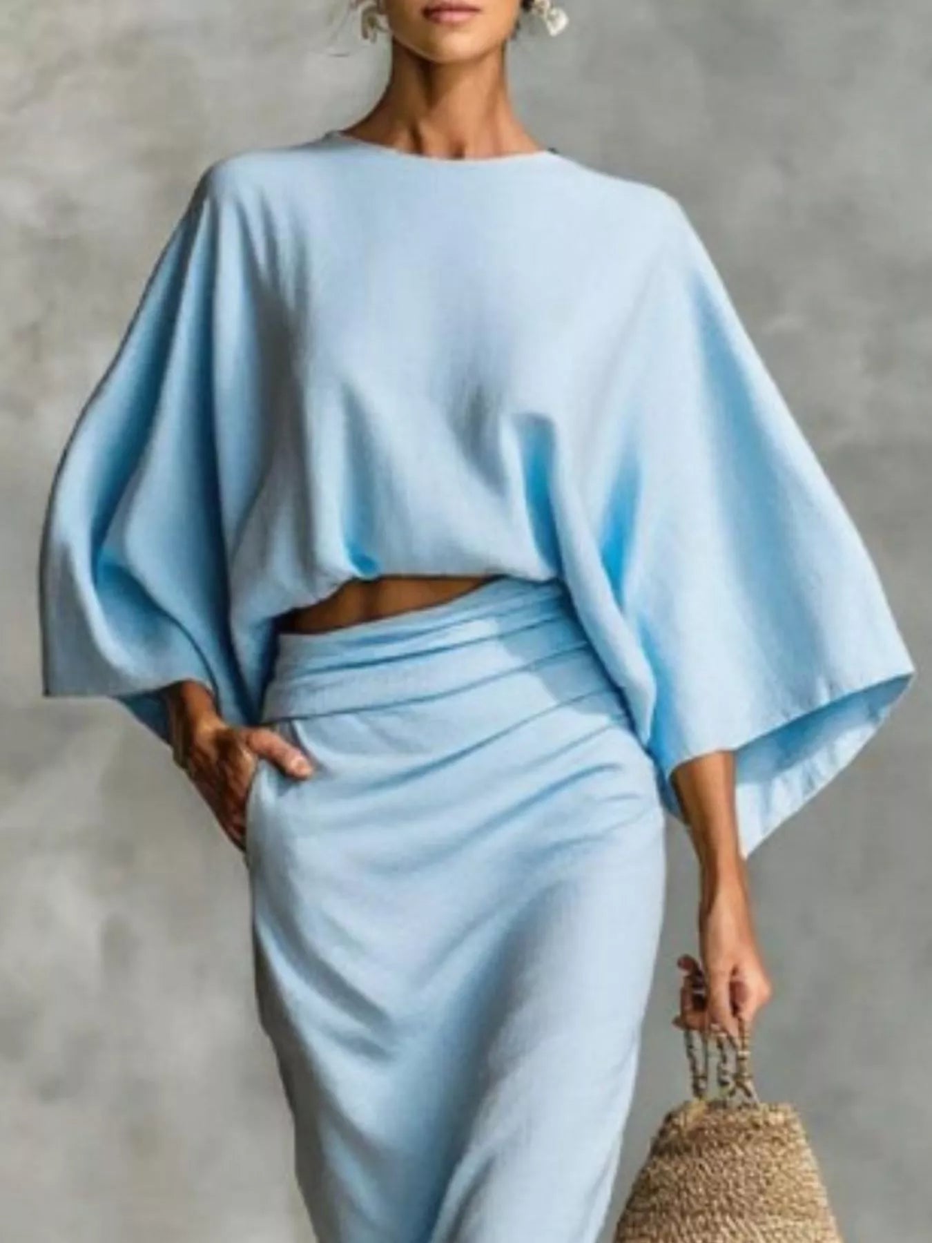 Model wearing a Kimono Sleeve Top and Ruched Skirt Set in light blue, showcasing an elegant two-piece outfit.