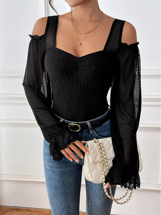 Cold Shoulder Flounce Sleeve Bodysuit styled with jeans and a chic handbag, showcasing elegant design and flounce sleeves.