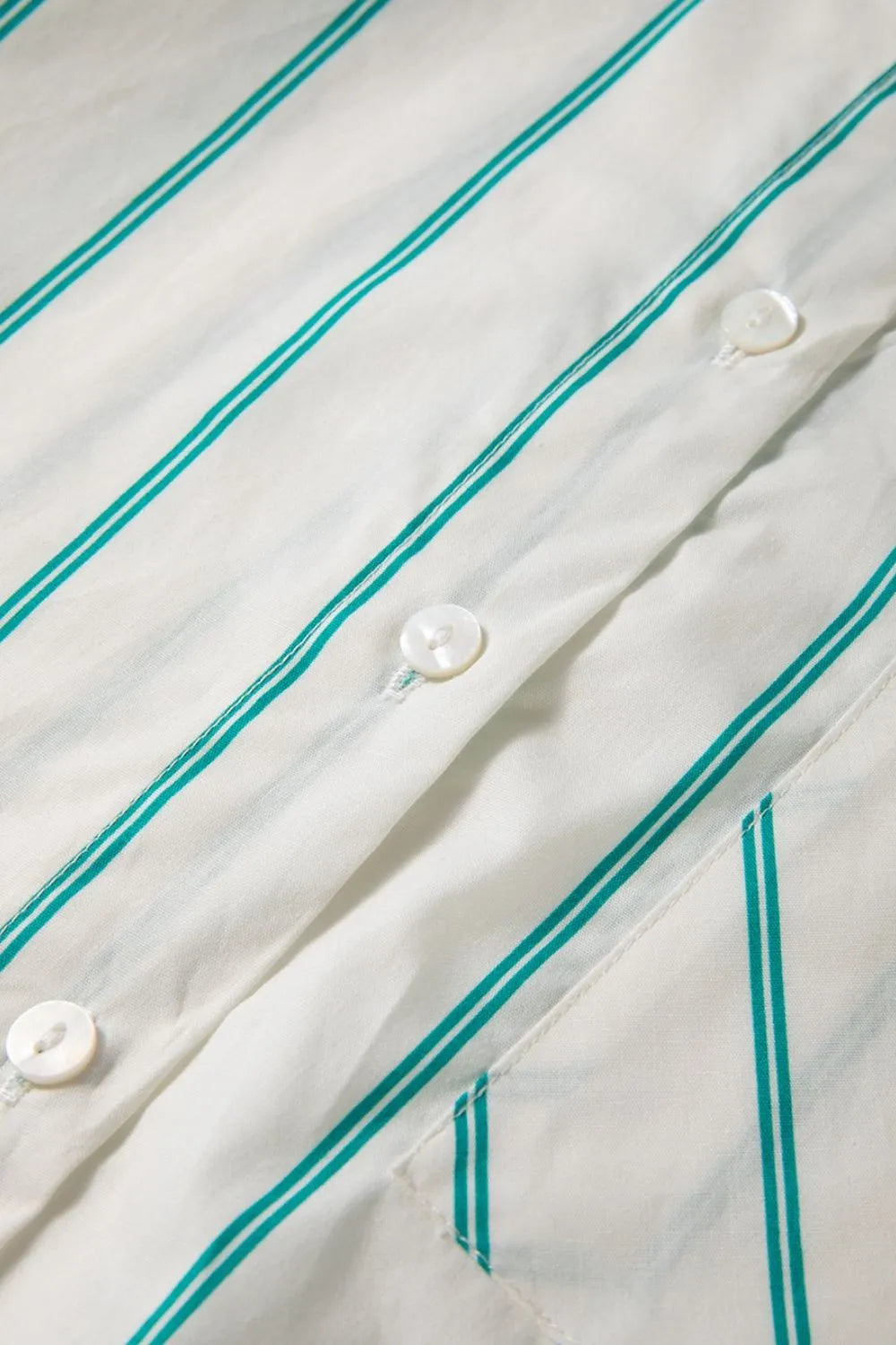 Close-up view of St Patricks Striped Wide Short Sleeve Shift Mini Shirt Dress with button details and stripes.