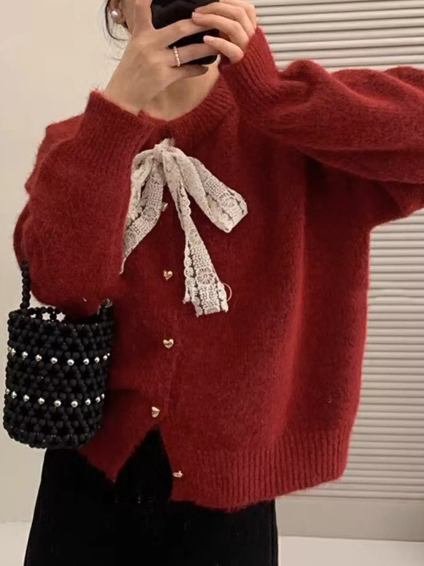 Lace Bowknot Knit Cardigan in red with lace bow, buttoned front, and slightly stretchy fabric, perfect for feminine everyday style.