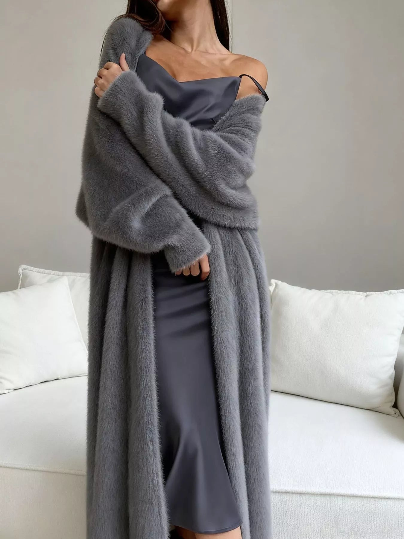 Fuzzy Open Front Longline Cardigan worn over a gray dress, showcasing its cozy and soft texture.