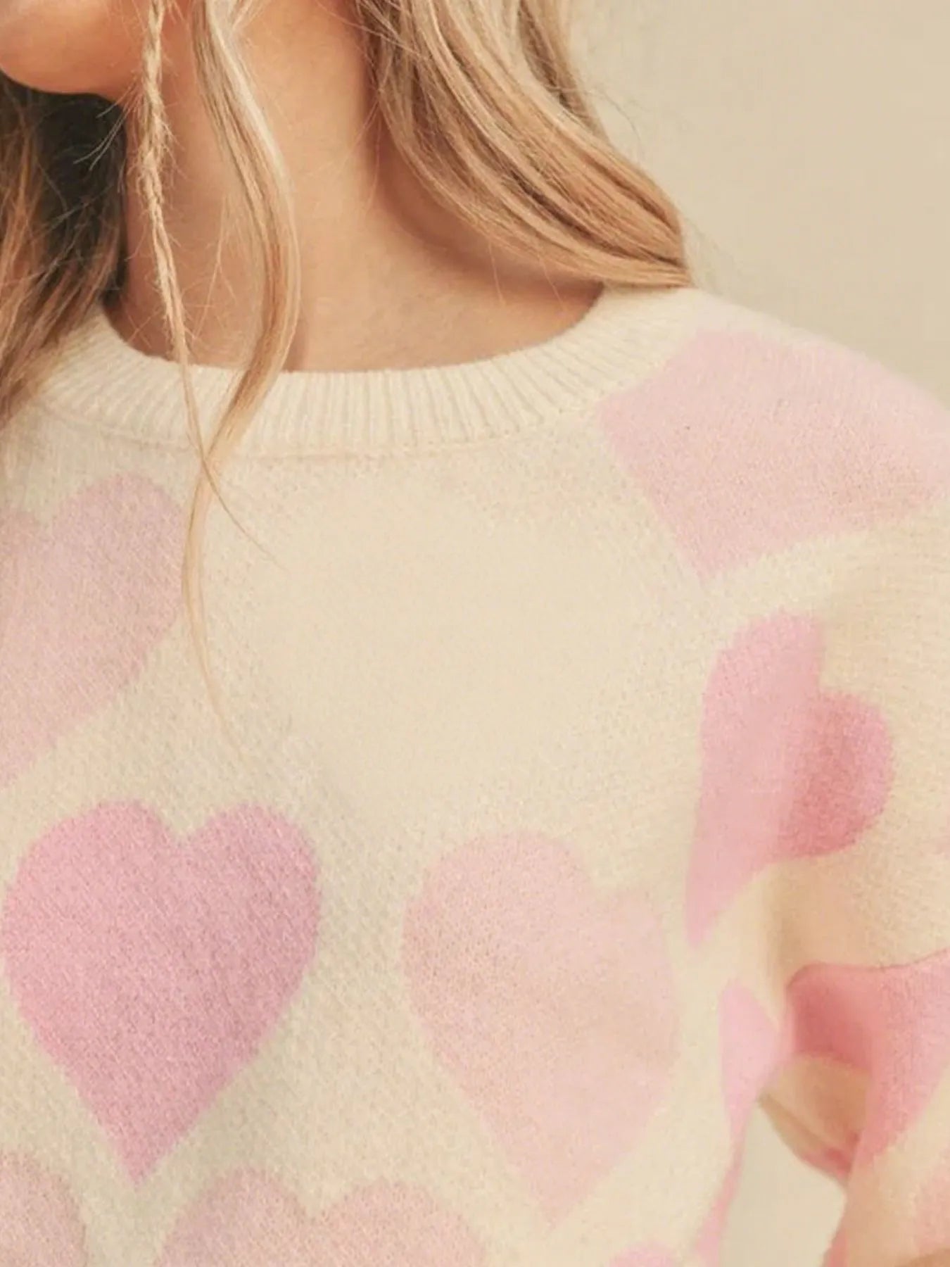 Heart Ribbed Hem Long Sleeve Sweater featuring a pink heart pattern and a cozy, slightly stretchy design.