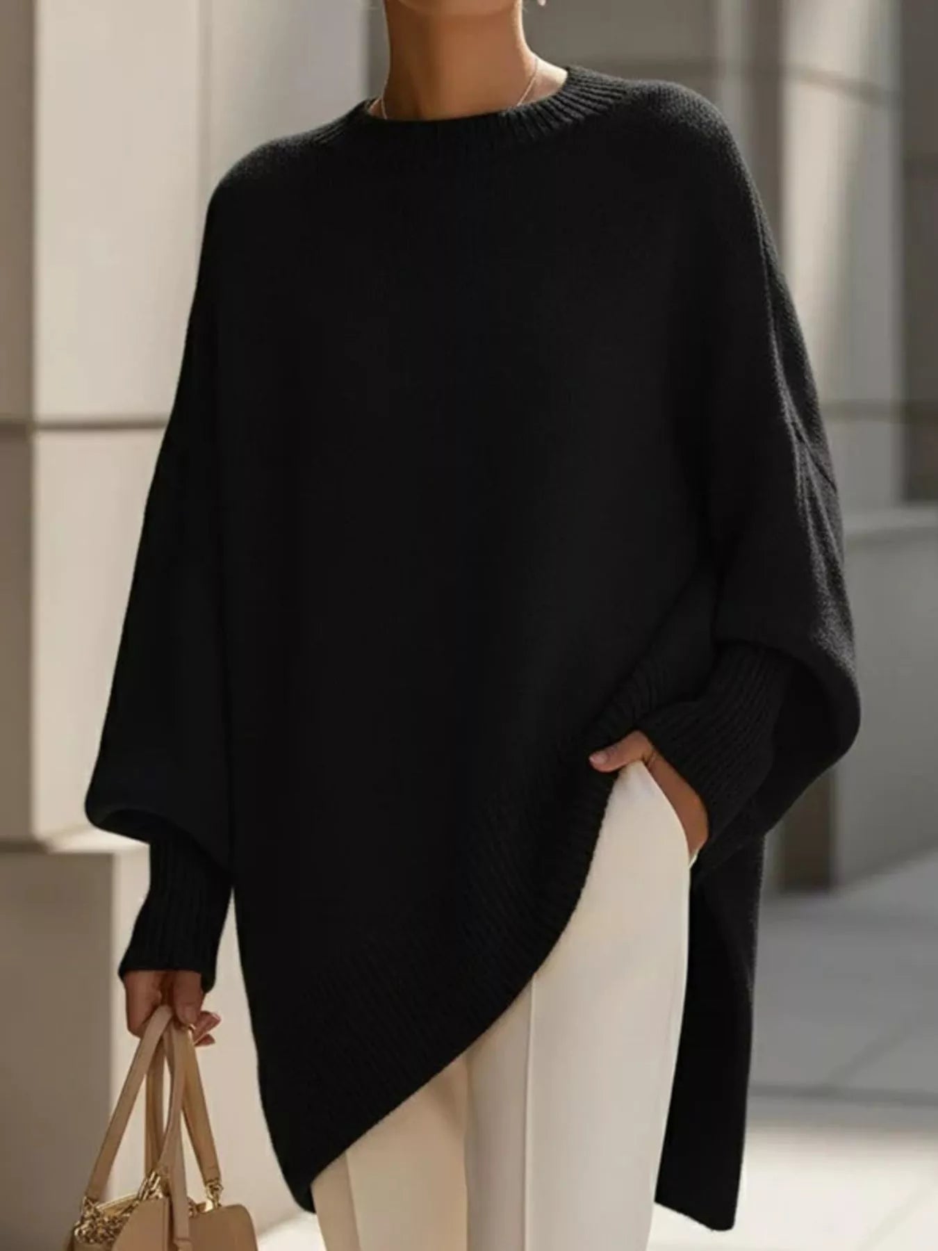 Oversized Batwing Sleeve Knit Sweater for Women in black, featuring ribbed design and slightly stretchy fabric.