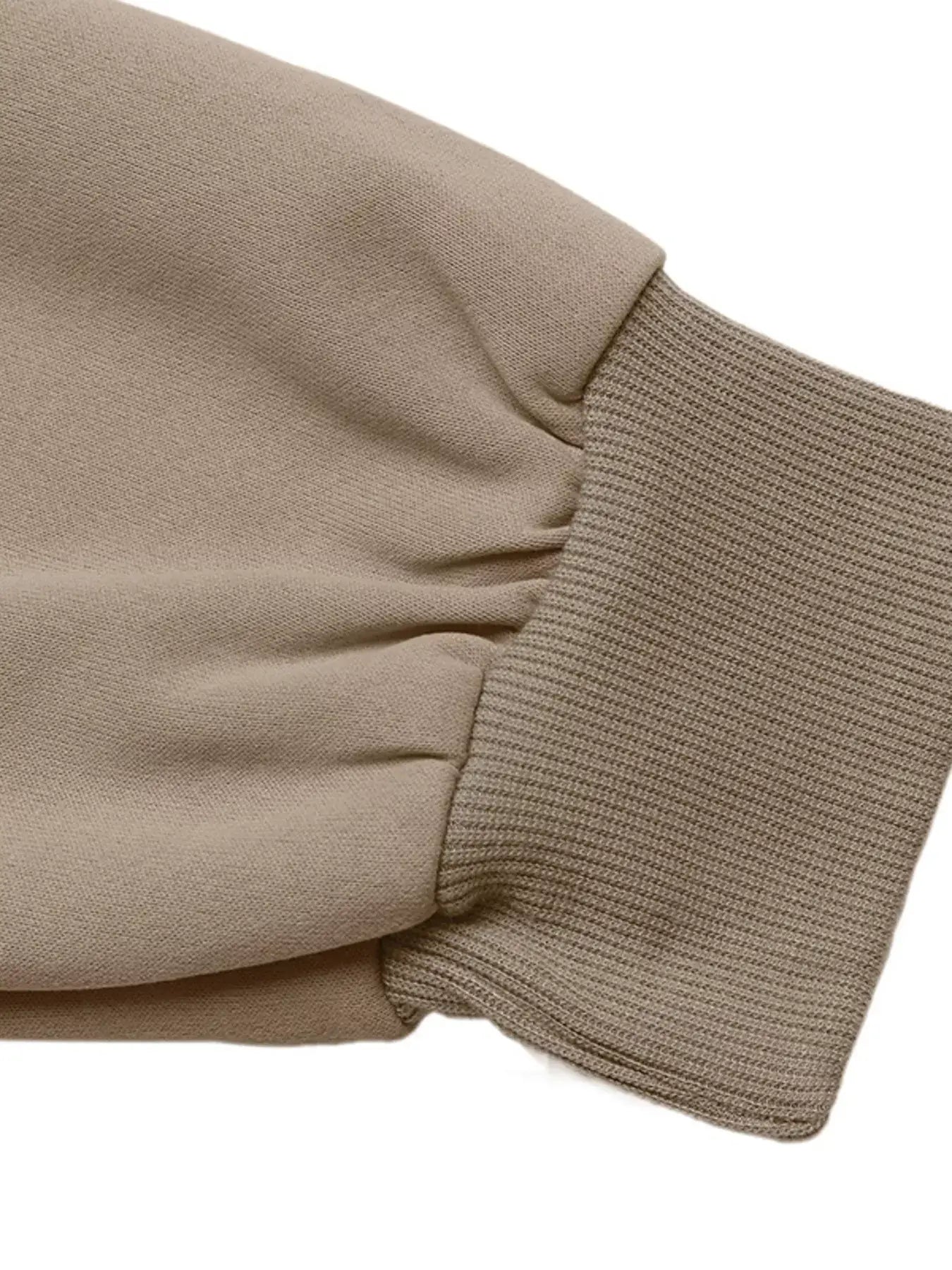 Detail of the sleeve cuff from the Zip Up Raglan Sleeve Jacket, showcasing a comfortable fit and fabric texture.