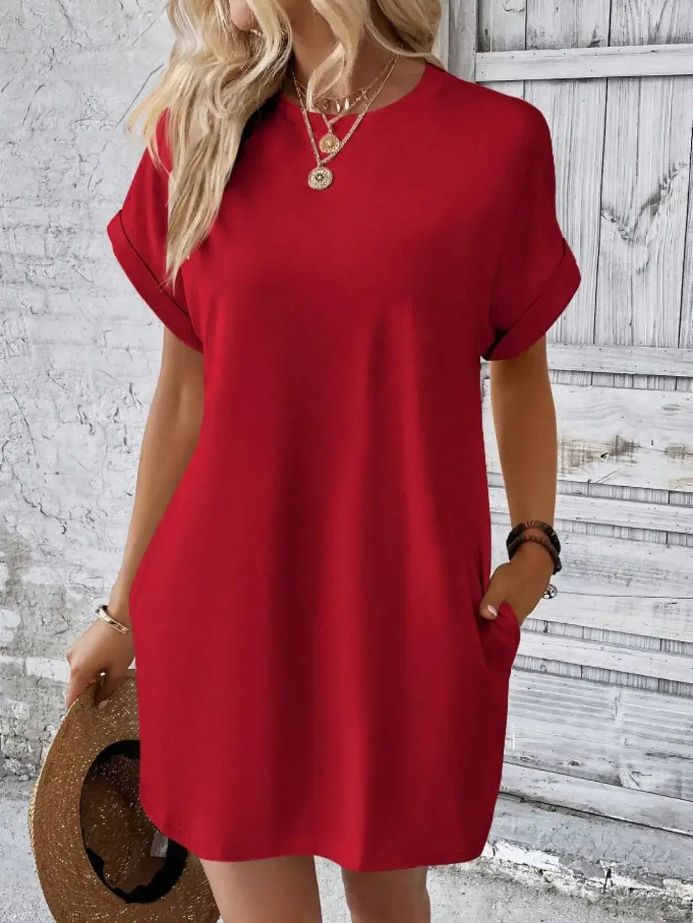 Stylish red pocketed round neck short sleeve dress on a model, featuring a casual look with trendy accessories.