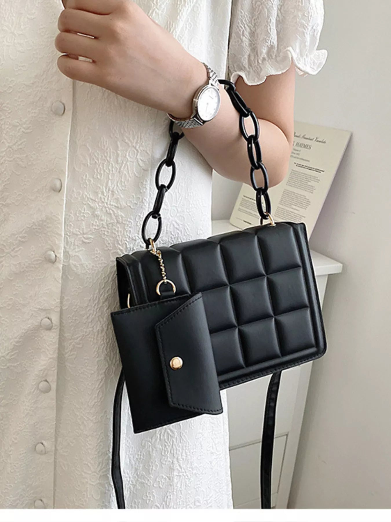 Quilted Chain Strap Crossbody Bag held by a person, showcasing the stylish mini PU leather design and chain strap.