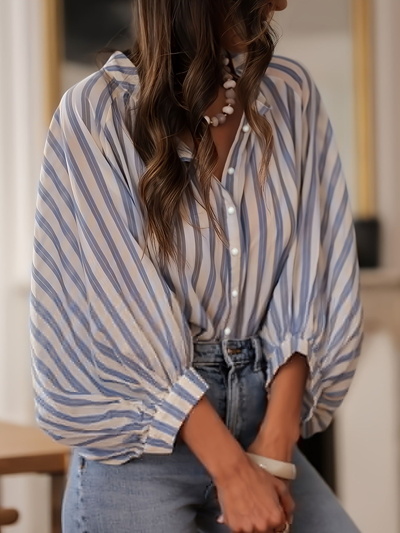 Striped Balloon Sleeve Button-Down Shirt worn with jeans, showcasing chic classic style and buttoned detail.