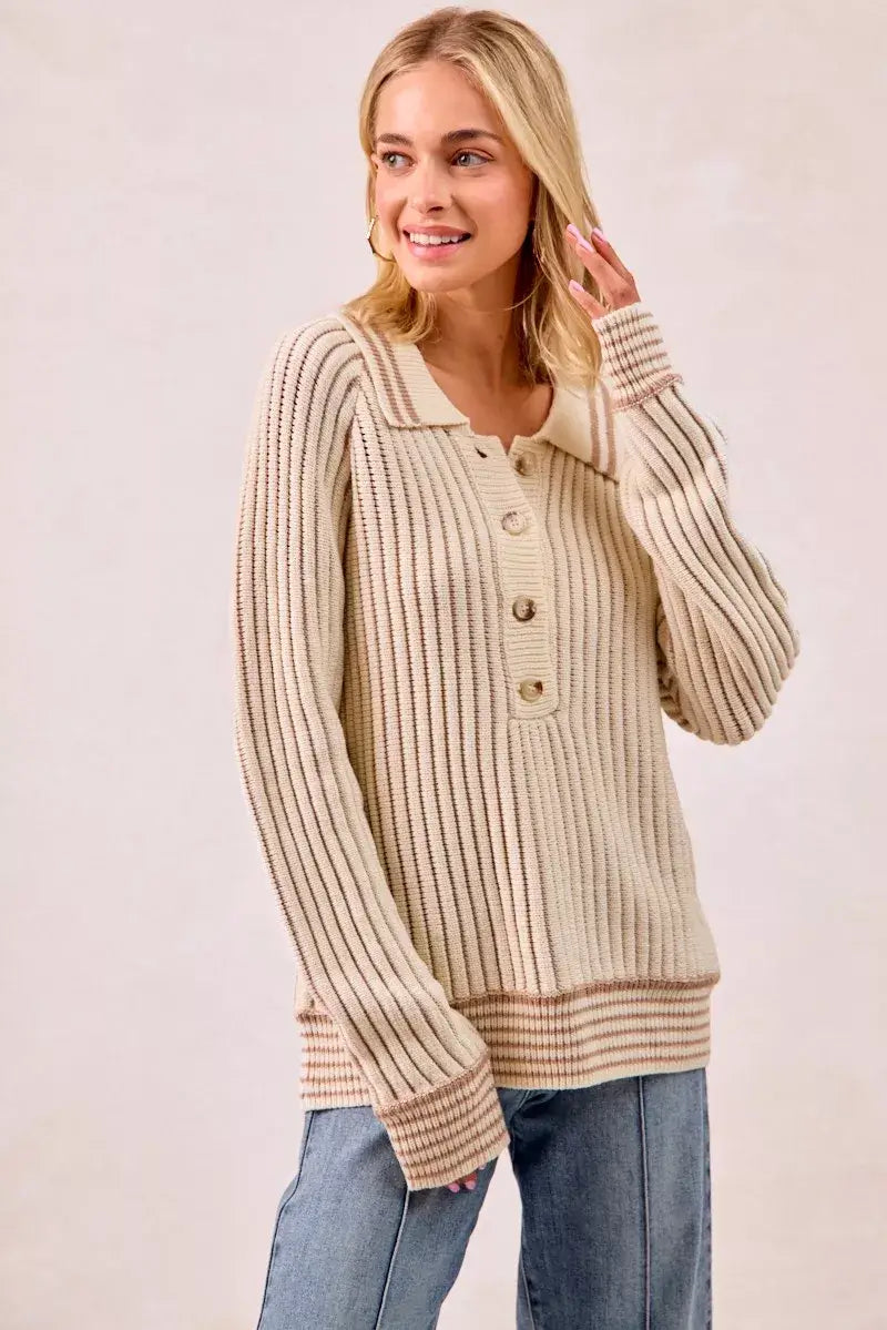 BiBi half button ribbed two tone sweater worn by a model, showcasing its cozy knit and stylish design.