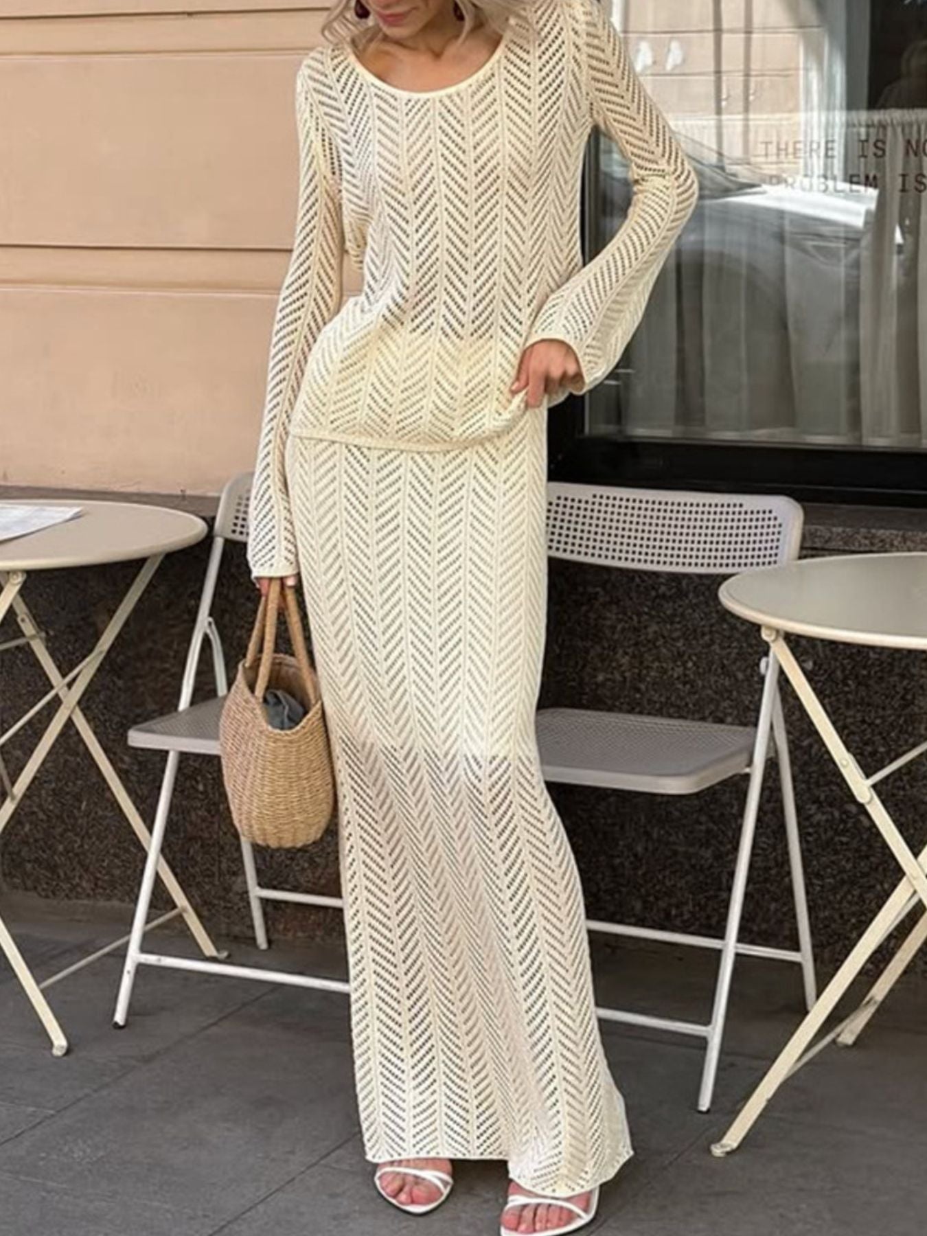 Openwork Long Sleeve Knit Top and Skirt Set Elegant Women Outfit worn by model outdoors