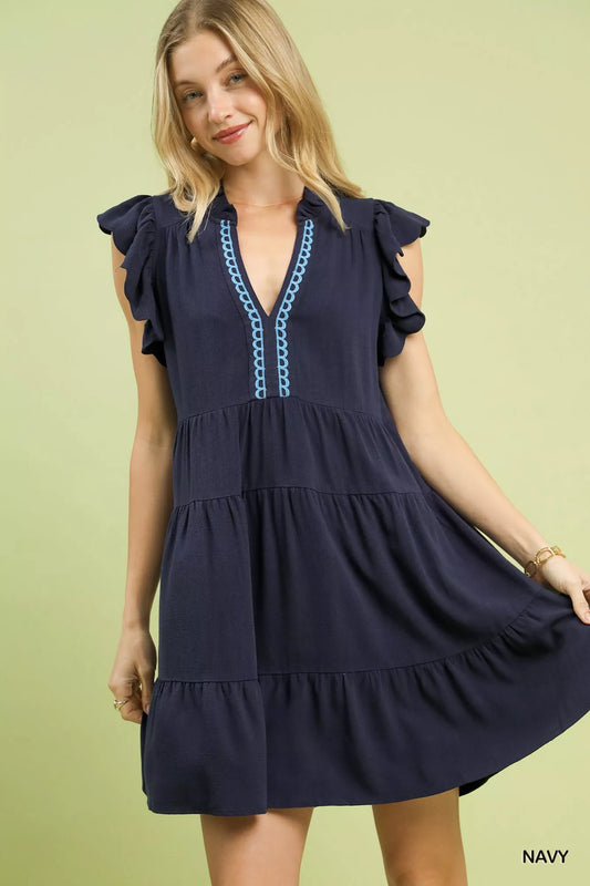 Umgee Linen Tiered Baby Doll Dress in navy with flutter ruffle sleeves and a relaxed fit.