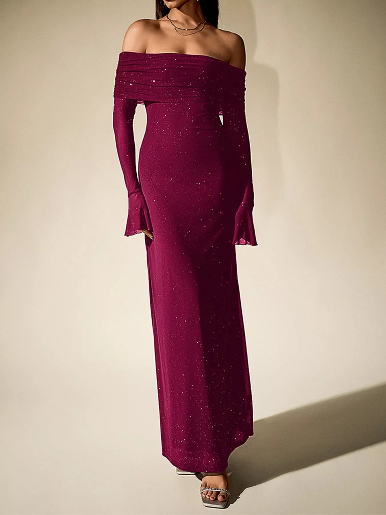 Glitter Off-Shoulder Maxi Dress showcasing a glittery burgundy design for elegant evening looks.