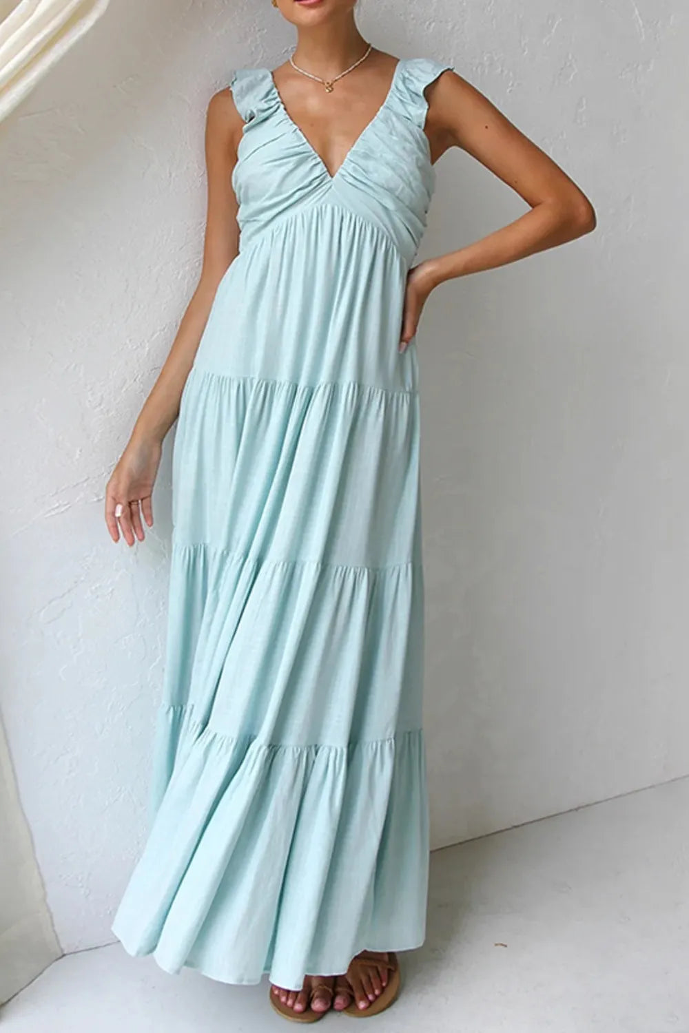 Ruffled V-Neck Tiered Dress in light blue cotton with ruffled sleeves and a flowing tiered skirt.