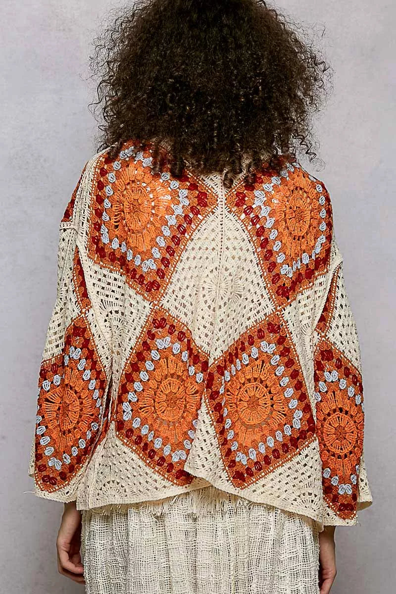 Back view of the POL Open Front Crochet Cardigan featuring a granny square pattern and intricate crochet details.