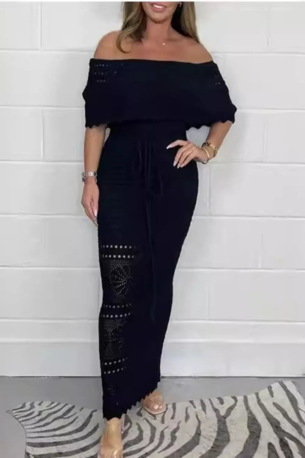 Model wearing a Crochet Off-Shoulder Maxi Dress with cutout details for elegant summer style.