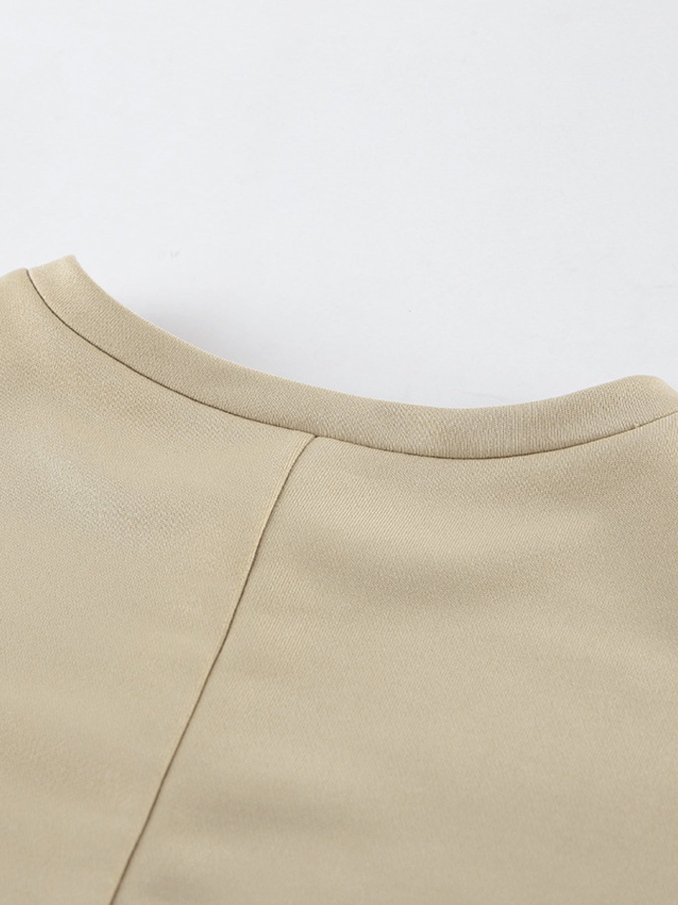 Close-up view of the Round Neck Top in beige from the Round Neck Top and Wide Leg Pants Set.