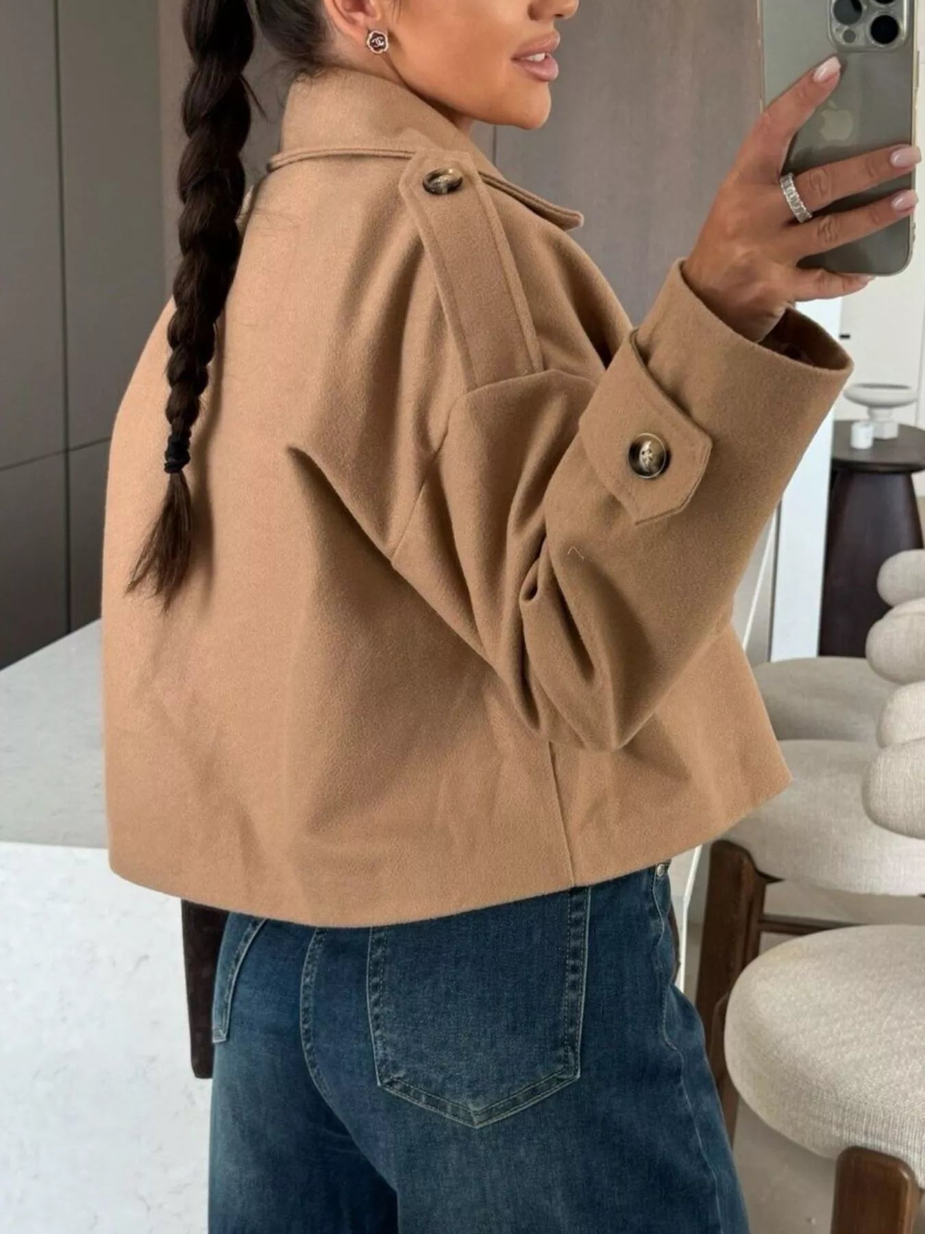Back view of a model wearing Double-Breasted Cropped Outerwear in brown with button details and a casual layered look.