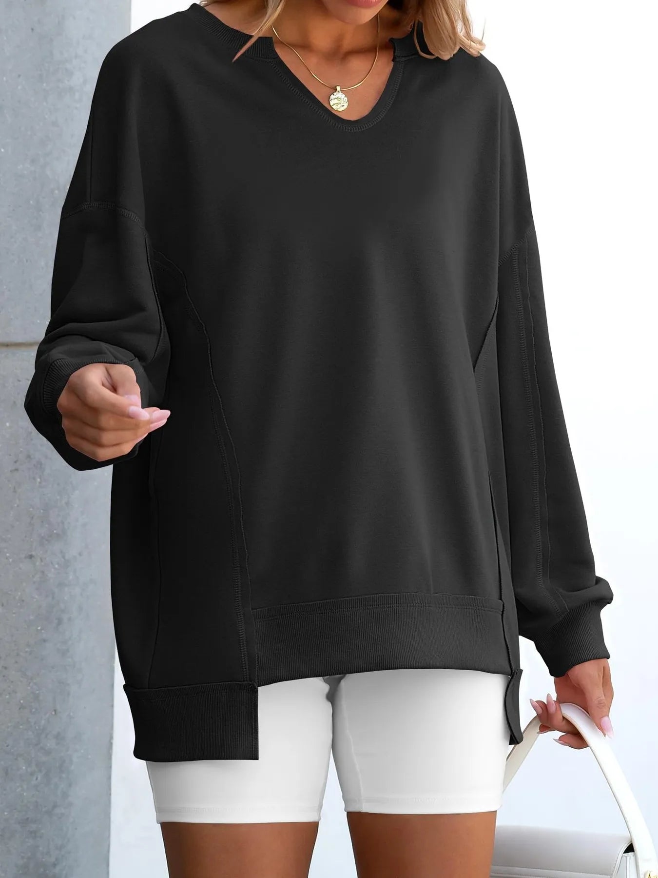 Notched Long Sleeve Oversized Sweatshirt in black, featuring contrast stitching, perfect for casual wear.