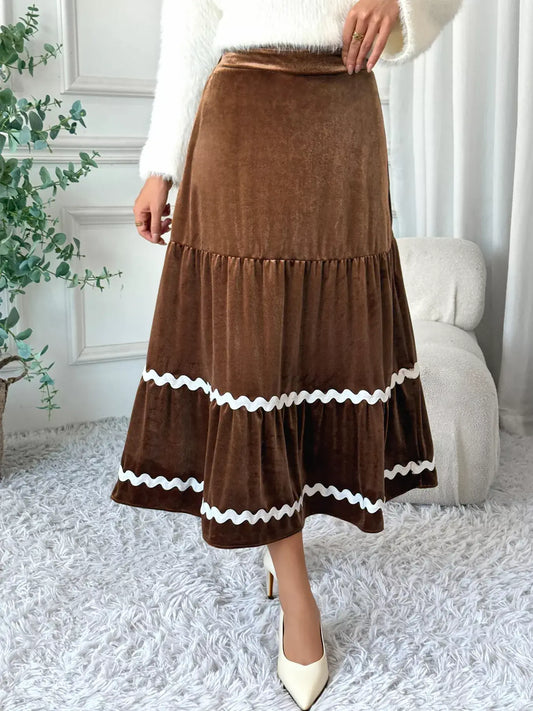 Velvet Tiered Midi Skirt in brown with white trim, showcasing a stylish and chic design perfect for elegant outfits.