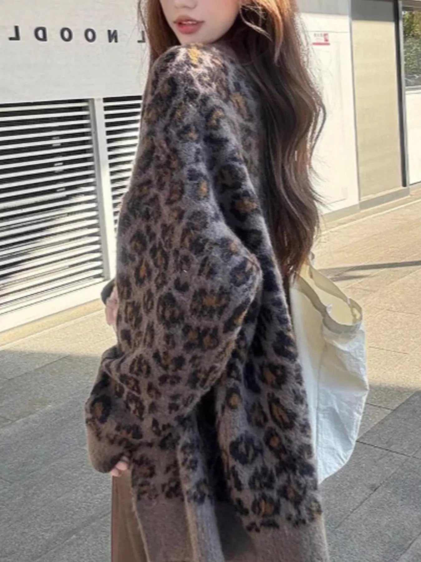 Leopard Button Up Cardigan featuring a stylish leopard print design, perfect for bold casual layering.