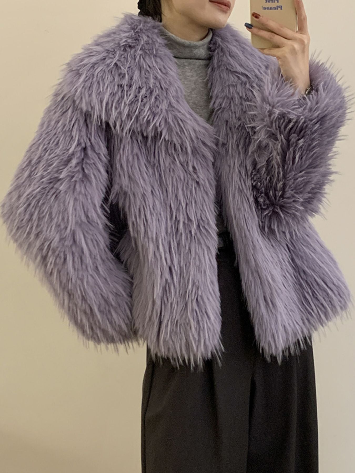 Model wearing a Faux Fur Open Front Outerwear in lavender, showcasing its soft texture and cozy style for winter.