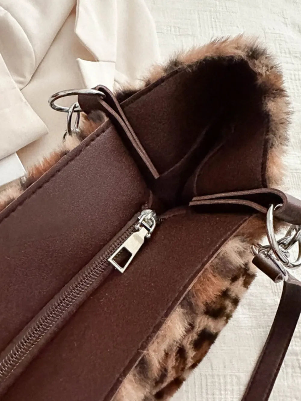 Interior view of Faux Fur Leopard Shoulder Bag showcasing zipper and lining details.