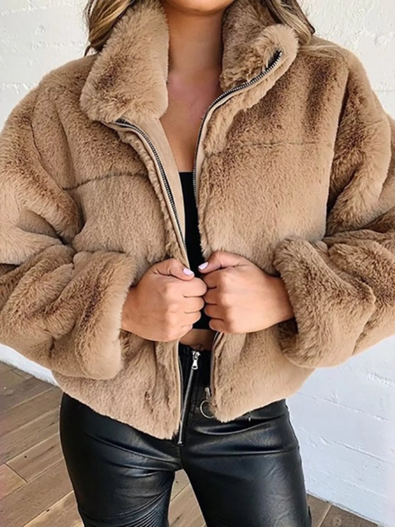 Faux Fur Cropped Zip-Up Jacket showcasing a cozy, oversized design with a zip closure, ideal for cold seasons.