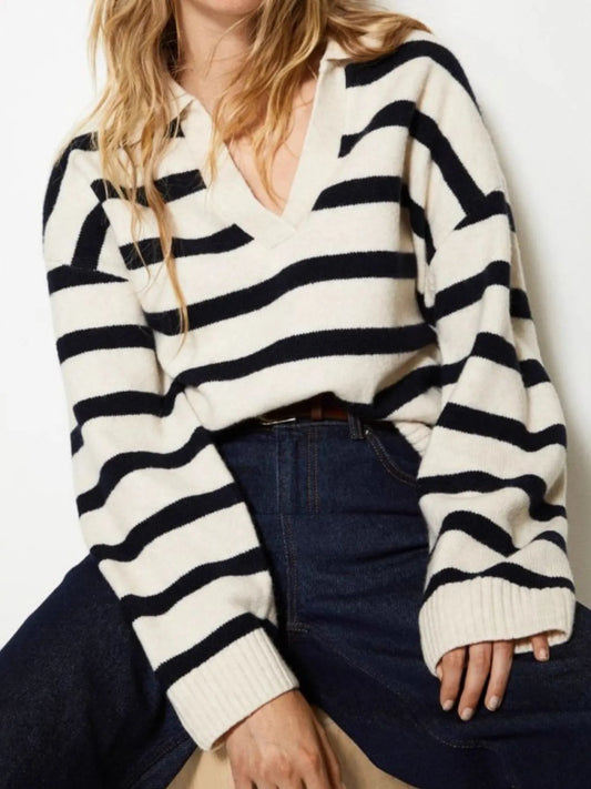 Model wearing a Striped Johnny Collar Long Sleeve Sweater in a cozy knit design, featuring a v-neck and relaxed sleeves.