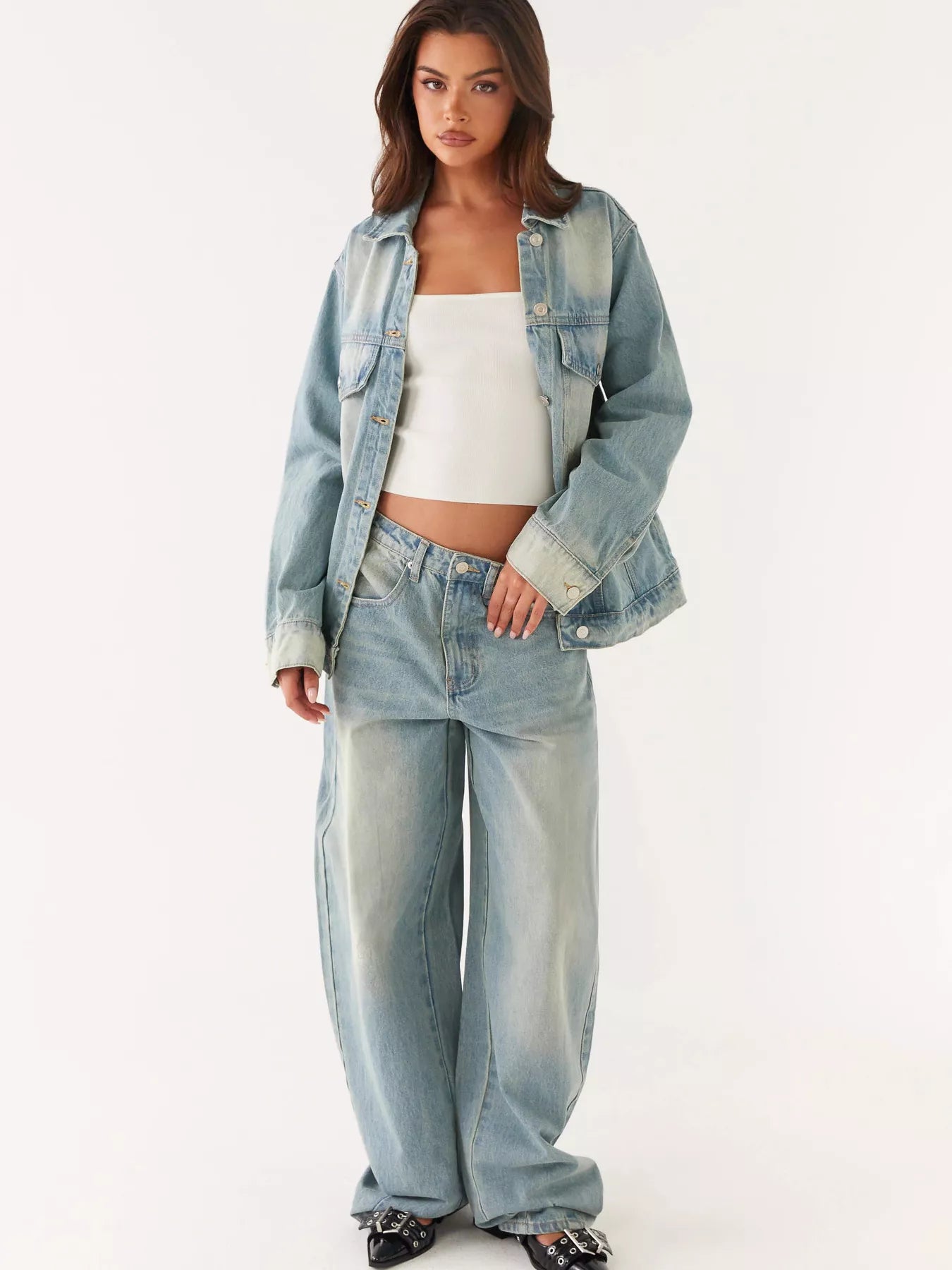 Button Up Denim Jacket and Jeans Set worn by model featuring a stylish, casual look with buttoned details.