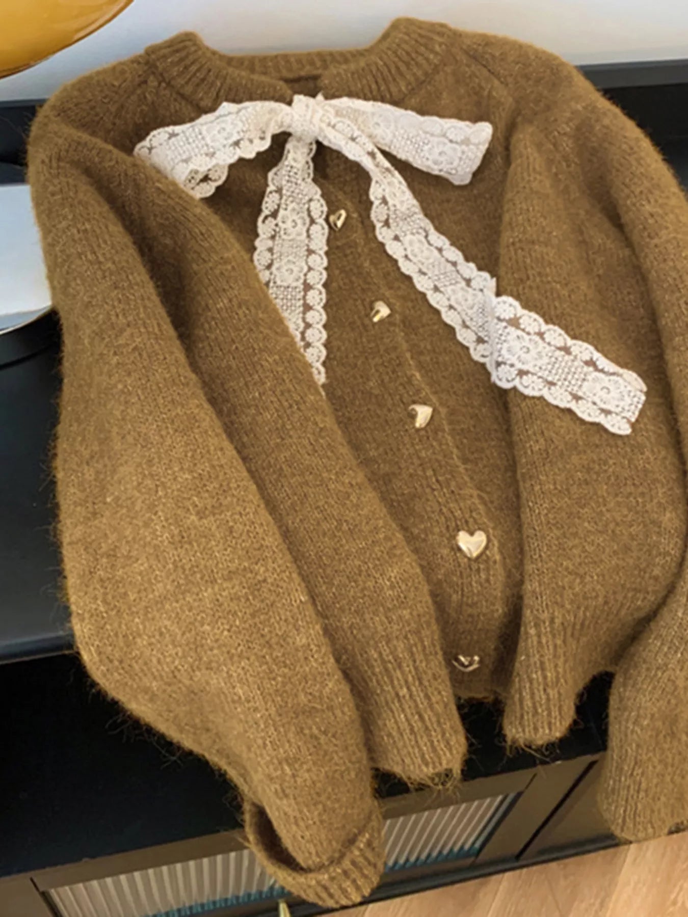 Lace Bowknot Knit Cardigan in warm brown with button detail, perfect for feminine everyday style.