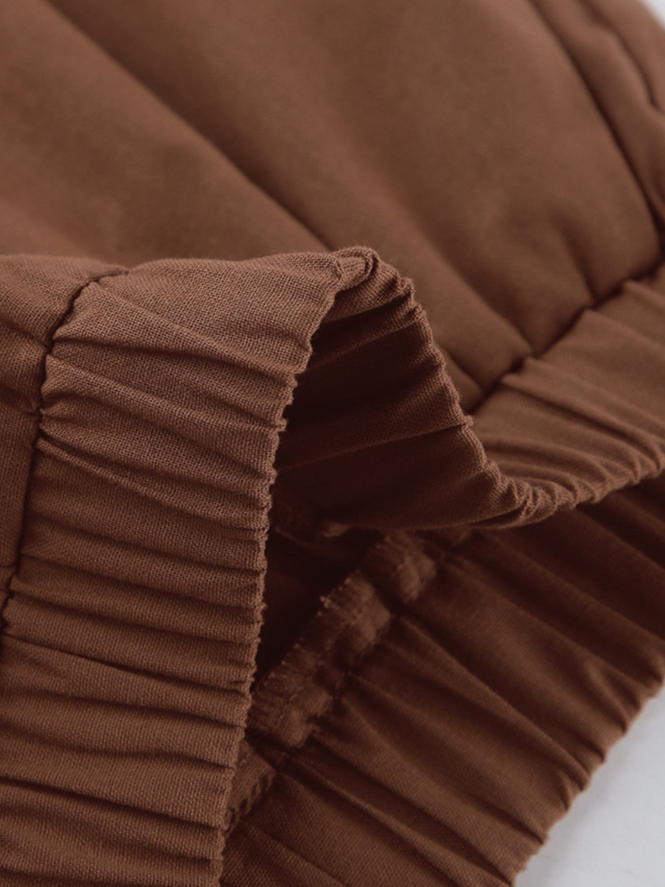 Close-up of the ruched detail on the One Shoulder Top and Shorts Set stylish asymmetrical outfit.