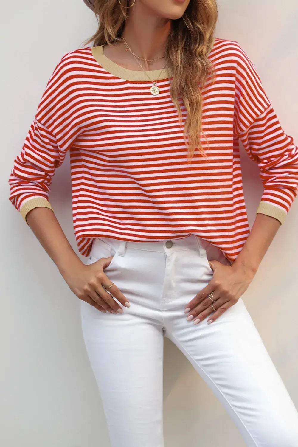 Striped Round Neck Drop Shoulder T-Shirt in red and white stripes, styled with white jeans for a casual look.