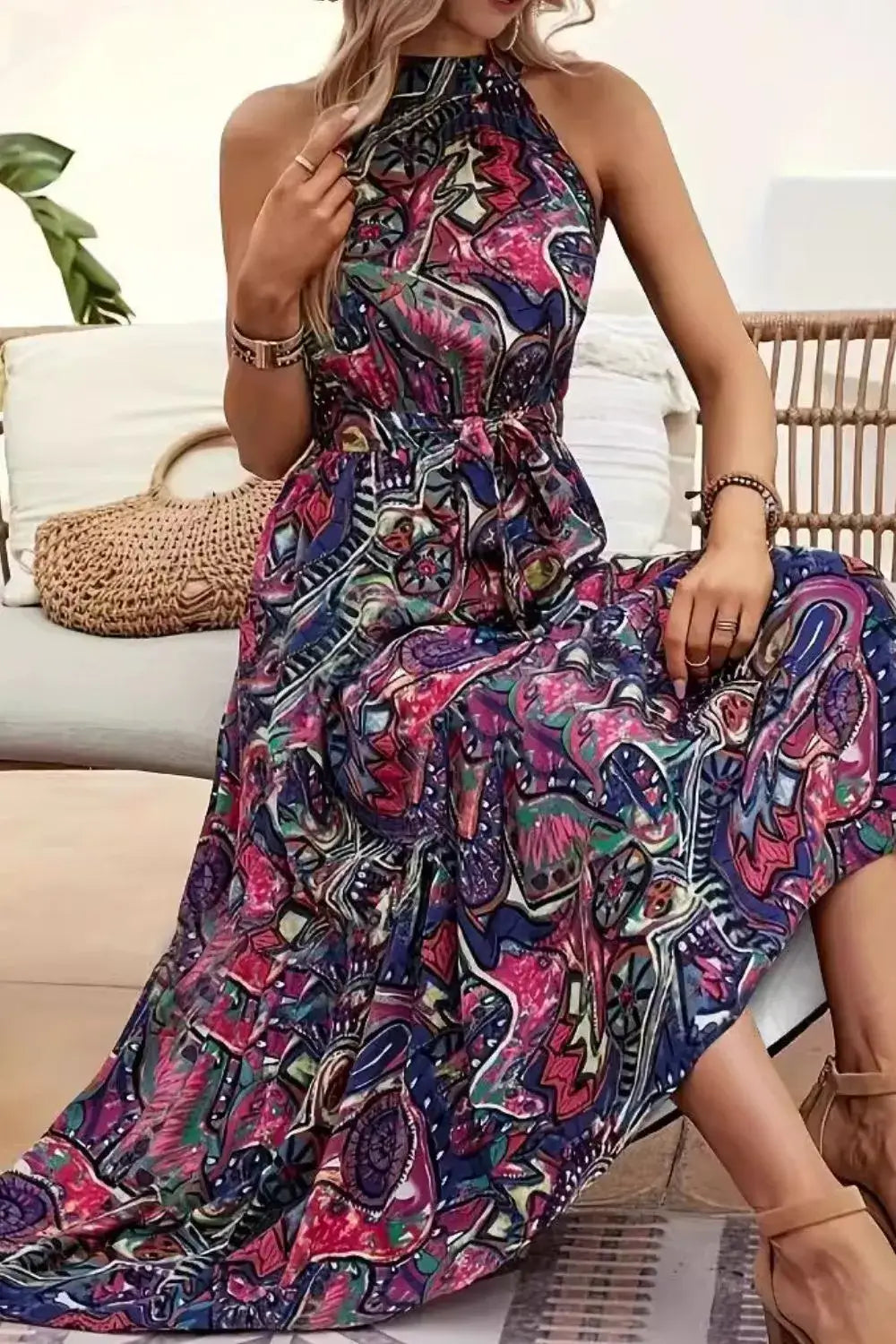 Tied Floral Sleeveless Dress featuring vibrant floral patterns and a flattering silhouette, perfect for summer occasions.